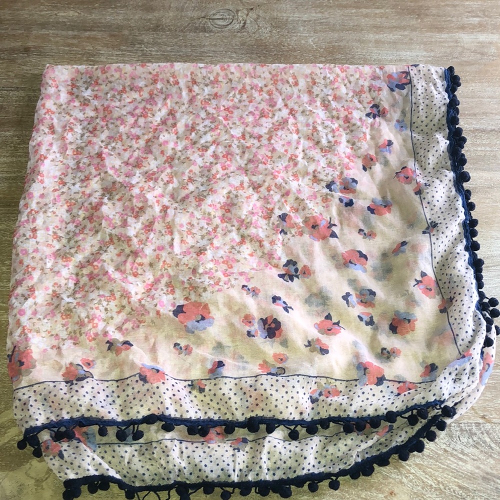 Light floral scarf with pom pom like trim